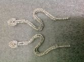 Brinco strass cobra